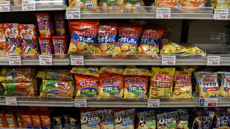 Bags of potato chips at the snack section at a Summit supermarket store in Tokyo, Japan, on Tuesday, July 27, 2021. Tokyo's delayed Olympics is flipping conventional wisdom on its head, with Japans stay-at-home stocks expected to emerge as winners rather than once-favored advertisers, real-estate firms and travel operators. Photographer: Noriko Hayashi/Bloomberg via Getty Images