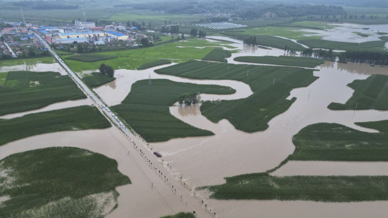 In this aerial photo released by Xinhua News Agency, flood waters course through fields and roads in Kaiyuan Town of Shulan in northeastern China's Jilin Province on Friday, Aug. 4, 2023. Northeastern China continued to be pelted by rain on Saturday, as authorities reported more deaths and missing people and evacuated thousands in the wake of Typhoon Doksuri. (Yan Linyun/Xinhua via AP)